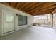 Covered back patio featuring exterior door and modern outdoor lighting at 2370 Burch Cir, Brookhaven, GA 30319