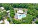Aerial view of a sparkling community pool surrounded by lush green trees at 2370 Burch Cir, Brookhaven, GA 30319