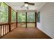 Inviting screened-in porch with ceiling fan provides serene views of the beautiful, wooded surroundings at 2370 Burch Cir, Brookhaven, GA 30319