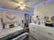 Inviting bedroom with updated light fixtures, decorative accents, and modern furnishings at 5108 Hackett Ne St, Covington, GA 30014