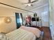 Bright bedroom features a four-poster bed, ceiling fan, and organized wardrobe space at 5108 Hackett Ne St, Covington, GA 30014