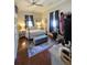 Bedroom featuring four-poster bed, ceiling fan, and hardwood floors at 5108 Hackett Ne St, Covington, GA 30014