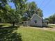 This charming home features a well-kept lawn and a fenced yard with mature trees at 5108 Hackett Ne St, Covington, GA 30014