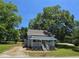 Charming single-story home with a quaint front porch and mature trees, offering a cozy and inviting curb appeal at 5108 Hackett Ne St, Covington, GA 30014