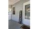 Cozy front porch with a 'Welcome' sign, offering a warm and inviting space to relax and enjoy the outdoors at 5108 Hackett Ne St, Covington, GA 30014