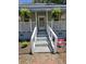 Close up of Front Porch. A quaint front porch with hanging plants and garden and a welcoming entrance at 5108 Hackett Ne St, Covington, GA 30014