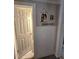 Hallway entrance with decorative art and an open doorway to the bathroom at 5108 Hackett Ne St, Covington, GA 30014