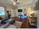 Well-lit living room with comfortable seating, hardwood floors, and decor for relaxation and socializing at 5108 Hackett Ne St, Covington, GA 30014
