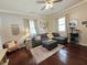 Spacious living room featuring a large sectional sofa, creating a cozy and inviting atmosphere at 5108 Hackett Ne St, Covington, GA 30014