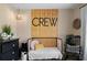 Charming Bedroom featuring a cozy crib, accent wall, and stylish decor at 71 Headland Ct, Rockmart, GA 30153