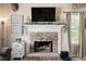 Cozy fireplace with stone surround, perfect for relaxation and ambiance in the living area at 71 Headland Ct, Rockmart, GA 30153