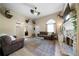 This living room boasts a stone fireplace and an open design to the home's front door at 71 Headland Ct, Rockmart, GA 30153