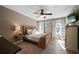 Spacious main bedroom features a ceiling fan, natural light, and neutral-toned walls at 71 Headland Ct, Rockmart, GA 30153