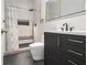 Modern bathroom features a walk-in shower, gray tile, and a sleek vanity at 918 Washington Sw St, Atlanta, GA 30315