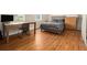 Bedroom featuring hardwood floors, natural light from a window, a study desk, and storage at 918 Washington Sw St, Atlanta, GA 30315