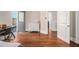 Bedroom with hardwood floors, a white dresser, and doorway to the outside at 918 Washington Sw St, Atlanta, GA 30315