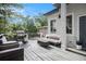 Relaxing deck with gray floors, comfortable seating, and a BBQ grill at 918 Washington Sw St, Atlanta, GA 30315