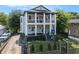 Classic two-story home with inviting double porches, a charming front yard, and a stone driveway at 918 Washington Sw St, Atlanta, GA 30315