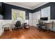 Spacious office featuring hardwood floors, white trim, and two windows providing ample natural light at 918 Washington Sw St, Atlanta, GA 30315