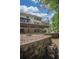 Picture of a backyard with stacked retaining wall and wood pile at 1325 Starboard Way, Cumming, GA 30041