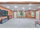 Spacious basement with wood paneled walls, carpeted floors, and ample natural light at 1325 Starboard Way, Cumming, GA 30041