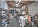 Unfinished basement area for storage, including shelving for shoes and other items at 1325 Starboard Way, Cumming, GA 30041