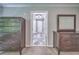Hallway off bedroom features neutral walls, marble floors, and views of the bathroom at 1325 Starboard Way, Cumming, GA 30041
