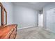 This bedroom features neutral carpeting and plenty of natural light at 1325 Starboard Way, Cumming, GA 30041