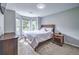 Bright bedroom with a bay window, carpet, and neutral walls, creating a serene and inviting atmosphere at 1325 Starboard Way, Cumming, GA 30041