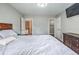 A bedroom features gray walls, carpet flooring and two doors at 1325 Starboard Way, Cumming, GA 30041