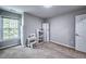 Bright bedroom with neutral walls, plush carpet, and a window bringing in natural light at 1325 Starboard Way, Cumming, GA 30041