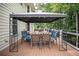 Exterior view of deck including a canopy, seating, and wood flooring at 1325 Starboard Way, Cumming, GA 30041