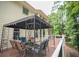 Exterior view of deck featuring wood flooring, a canopy, and outdoor seating at 1325 Starboard Way, Cumming, GA 30041