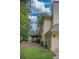 Exterior view showcasing the deck overlooking the backyard with ample space for outdoor activities at 1325 Starboard Way, Cumming, GA 30041