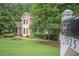 Well-maintained front lawn with lush landscaping and a mailbox at 1325 Starboard Way, Cumming, GA 30041