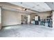 Spacious two-car garage with storage shelving and concrete flooring at 1325 Starboard Way, Cumming, GA 30041