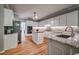 Kitchen featuring an island, stainless steel appliances, and granite countertops at 1325 Starboard Way, Cumming, GA 30041