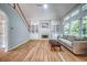Bright living area with fireplace, vaulted ceiling, natural light and staircase to the second floor at 1325 Starboard Way, Cumming, GA 30041