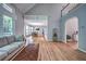 Spacious living area with hardwood floors, a staircase, and an open layout connecting to the dining area at 1325 Starboard Way, Cumming, GA 30041