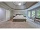 Spacious main bedroom features neutral walls, carpeting, tray ceiling and lots of natural light at 1325 Starboard Way, Cumming, GA 30041