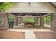 Covered picnic area with stone pillars, wooden picnic tables, and an outdoor grilling station at 1325 Starboard Way, Cumming, GA 30041