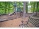 Community playground featuring a slide, climbing structure, and seating area surrounded by trees at 1325 Starboard Way, Cumming, GA 30041
