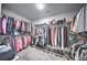 Spacious walk-in closet with ample shelving and hanging space for clothes and accessories at 1325 Starboard Way, Cumming, GA 30041