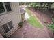 Backyard featuring landscaped yard with stepping stones along the side of the house at 1325 Starboard Way, Cumming, GA 30041