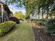 Well-kept backyard featuring manicured lawn and tastefully landscaped flower beds at 2610 Stokesley Way, Snellville, GA 30078