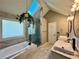 Bright bathroom with a skylight over soaking tub and glass shower at 2610 Stokesley Way, Snellville, GA 30078