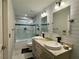 Updated bathroom with dual sinks, modern fixtures, and tiled shower at 2610 Stokesley Way, Snellville, GA 30078