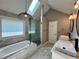 Bathroom featuring tub and walk in shower with rain head shower fixture at 2610 Stokesley Way, Snellville, GA 30078