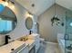 Bright bathroom featuring dual sinks, marble countertops, and modern fixtures at 2610 Stokesley Way, Snellville, GA 30078
