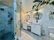Contemporary bathroom with glass shower, dual sinks and modern fixtures at 2610 Stokesley Way, Snellville, GA 30078